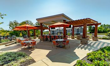 Outdoor Grill With Intimate Seating Area at River Crossing Apartments, St. Charles, Missouri